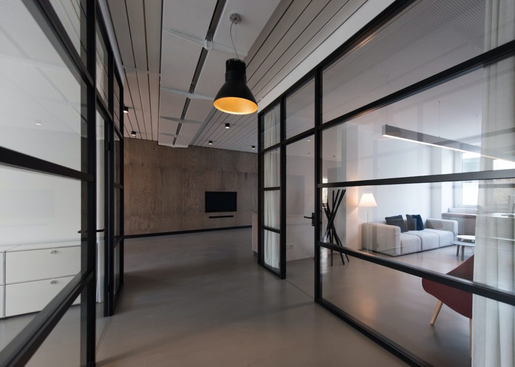 room with glass divider and white curtain